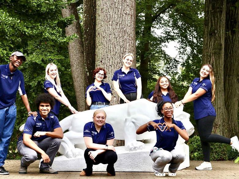 CAPS Student Peer Counselor around Lion Shrine